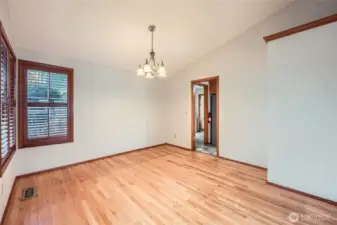 Vaulted ceilings in the formal dining room that opens to the living room.