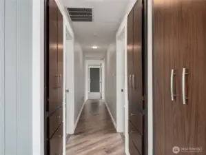 Hallway leading to three bedroom and two full bathrooms.