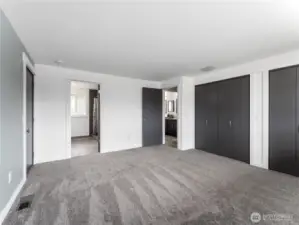 Primary suite bedroom with access to outside.
