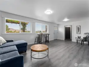 Lower level offers direct access to backyard parking and a private hot tub retreat.