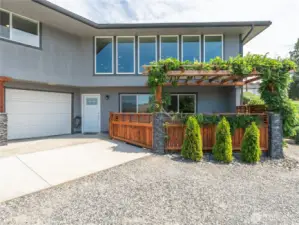 Lower-level garage with backyard access, private outdoor spa area, and footings in place for a future deck expansion.