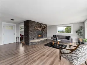 Upper-level front entry opens to a beautifully updated, light-filled living space.