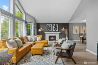 The home boasts vaulted ceilings and large windows, creating a bright, open atmosphere.