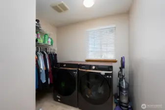 Nice sized laundry room provides additional storage
