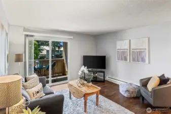 Living room has ample space, newer lvp flooring and electric heat.