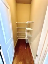 Large walk-in pantry of the butler area between kitchen and formal dining.