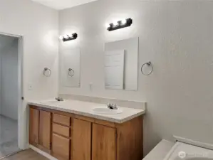 Spacious dual sink vanity offering extra counter space and storage—perfect for busy mornings.
