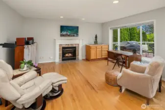 fmaily room boast a gas fireplace. TV in family room stays.