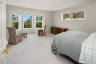 primary suite offers a serene retreat with alcove windows