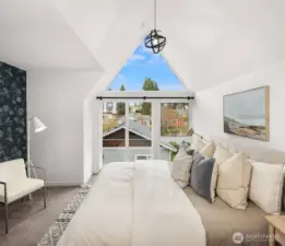 Luxurious primary suite spans the top floor.