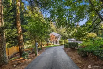 Set on a level and usable acre, the private driveway leads you to an expansive 4,360 sq. ft. home