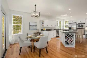Kitchen area with new hardwood floors.