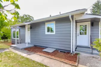Front and side door facing road.