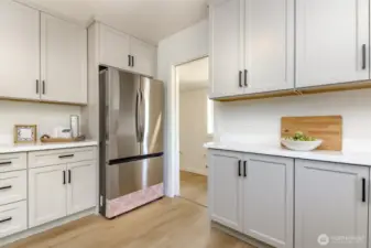 Kitchen w/stainless brand new appliances and quartz countertops.