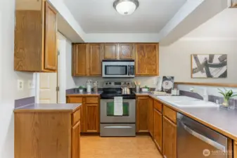 Super convenient kitchen features a breakfast bar