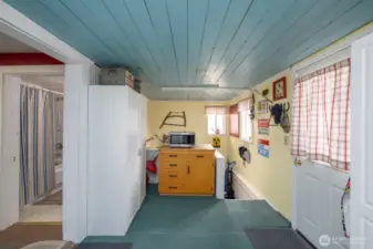 Laundry/Mud Room.  Stairs lead to the crawl space.  There's a freezer, water softener, & ice maker in that space.