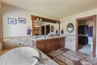 Upgraded tile throughout primary bathroom