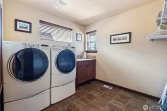 Spacious laundry room with a manifold system for water shutoff