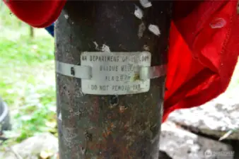 Department of Ecology ID tag on well head.