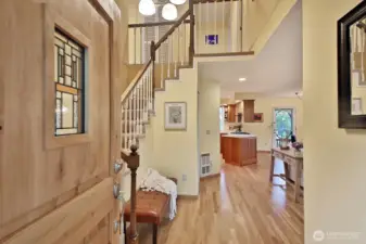 Hardwood floors and vaulted ceiling entry welcome you. Stairs to the left lead to the Primary Suite, 3 additional bedrooms, an office & a flex room. There is also a small bedroom and 3/4 bath on this main level.