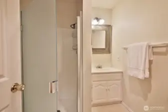 3/4 Main Level Bathroom located off the kitchen near the entrance to the garage and across from the laundry room.