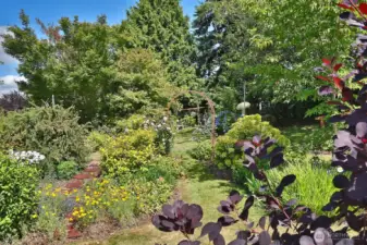 Come and enJOY the beauty and peace of this magical Langley property.