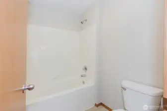 Full bath with tub/shower combo.
