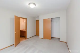 Bedroom with double closet doors.