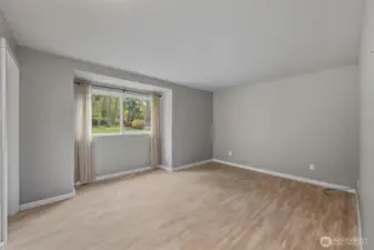 Primary bedroom with views of private backyard