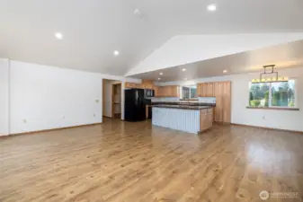 This view is from the great room looking back to the kitchen and dining room.