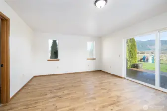 The primary bedroom has a slider to the deck. Wake up to the territorial view.