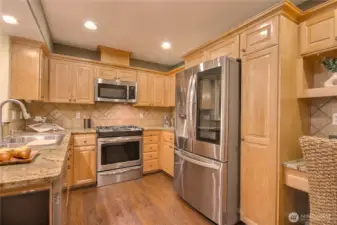 Enjoy your deck area which can be used as an appliance center. Lots of cabinet space.