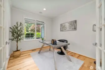 A private home office is conveniently located just off the entryway