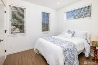 Second top floor bedroom, slightly smaller than primary ensuite, but still large enough to fit a queen bed comfortably.