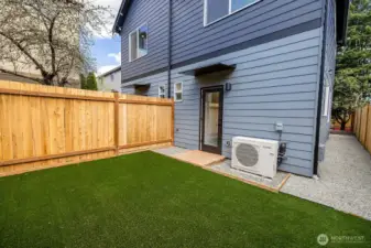 Looking back towards the home, notice the side walkway connects the front and backyards.