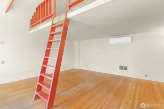 Loft Stairs and View of Living Room.