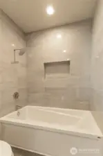 Large tub in hallway guest bath