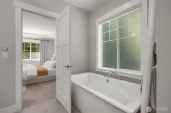 Relax in your soaking tub letting in natural light through the privacy window.