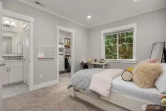 Bedroom 2 with a shared on suite bathroom and walk in closet.
