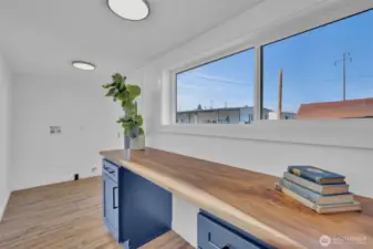 Huge window with views of the back yard, letting in tons of natural light!