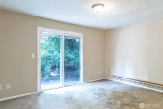 primary bedroom with slider to back yard.