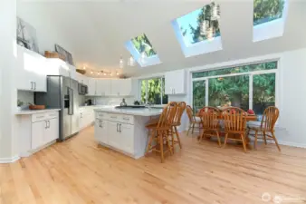 Additional view of the open-concept kitchen, featuring exceptional views that beautifully bring the outdoors in.
