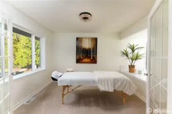 Master bedroom offers an adjacent versatile room perfect for serene spa area, sitting or hobby room, nursery, or additional office space.
