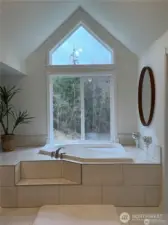 Enjoy soaking in the master bedroom en suite jacuzzi tub.