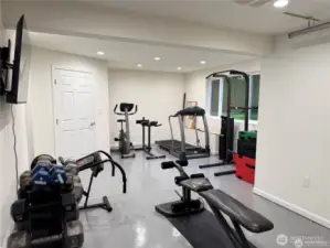 An additional single garage space in the basement offers versatility -  ideal for use as a hobby room, home gym, or extra garage storage.
