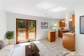 Great Room w/French Doors to Deck Overlooking the Pool  Virtually Staged