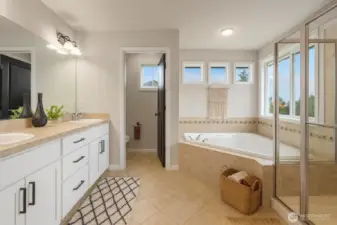 Large Primary Ensuite with dual sinks and two seperate closets. Virtually Staged