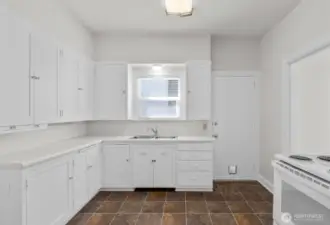The upper-level kitchen has been freshly painted.