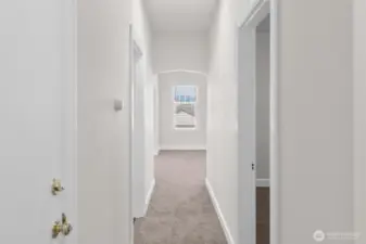 Upper-level looking down the hallway toward living room.