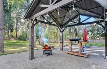 The large extended patio is a perfect outdoor living space, thoughtfully shaded by a newer gazebo that adds both style and comfort. Whether you’re hosting a summer BBQ or simply spending warm evenings with loved ones, this area creates a cozy and inviting atmosphere. The gazebo offers shelter from the sun while still letting you enjoy the fresh air, making it ideal for dining, relaxing, or entertaining. It’s the perfect spot to create lasting memories in your private backyard.